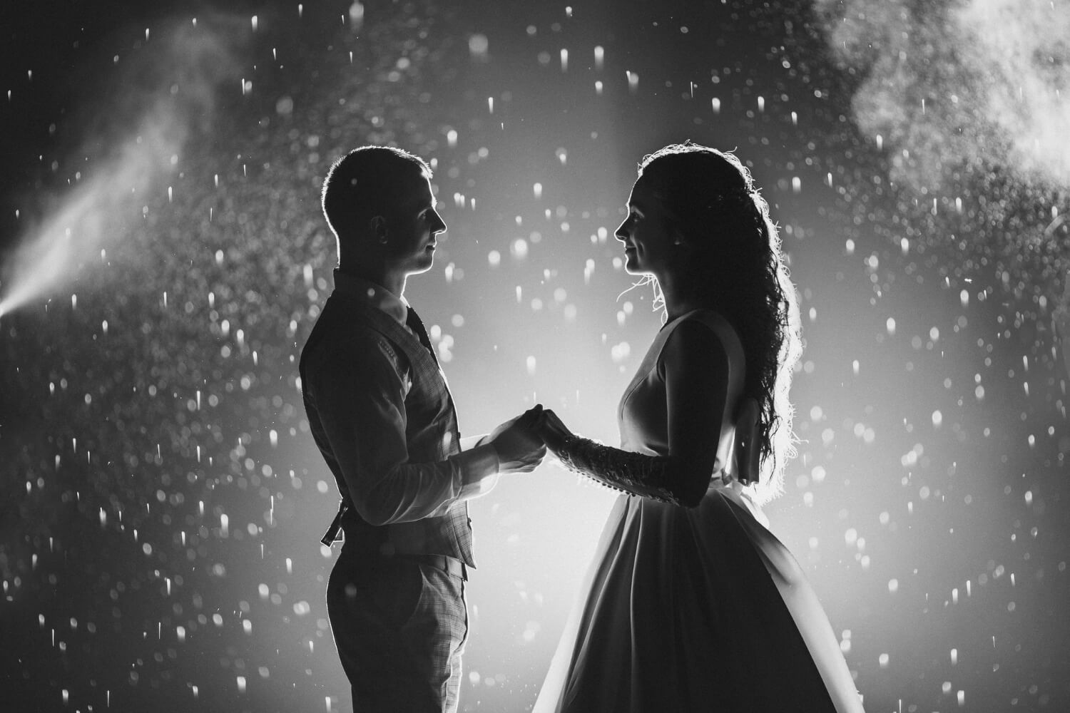 side view black white stock photo cheerful bride groom holding hands